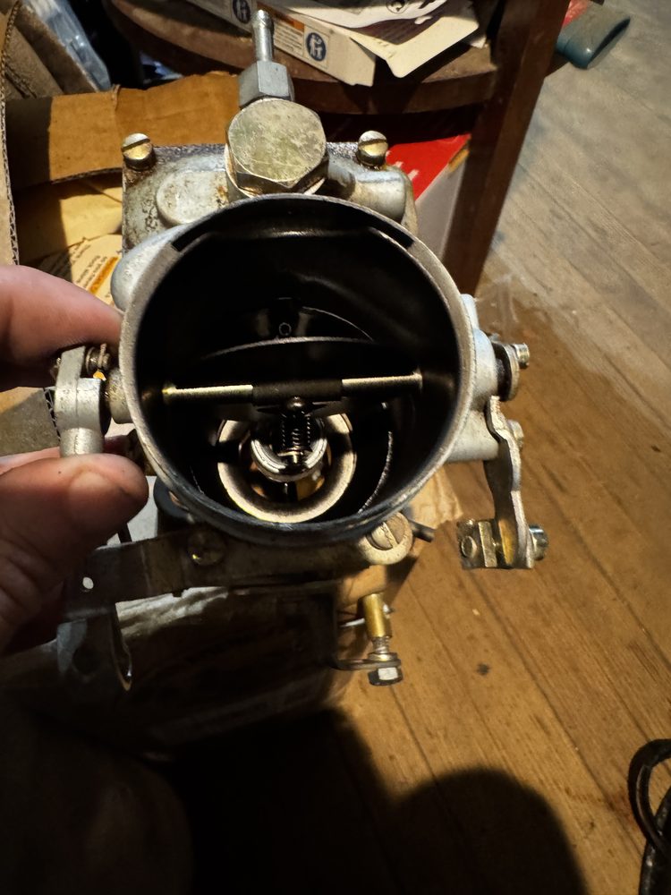 Air horn bore with choke plate held open revealing primary venturi 50 and main discharge nozzle 51
